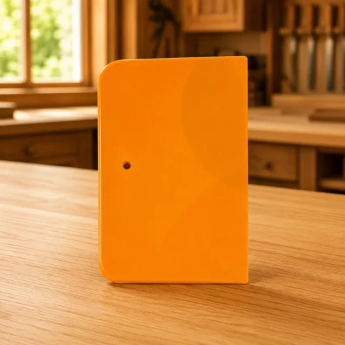 WRP 4-inch plastic spreader for applying, shaping, and smoothing epoxy putty during professional wood restoration projects.